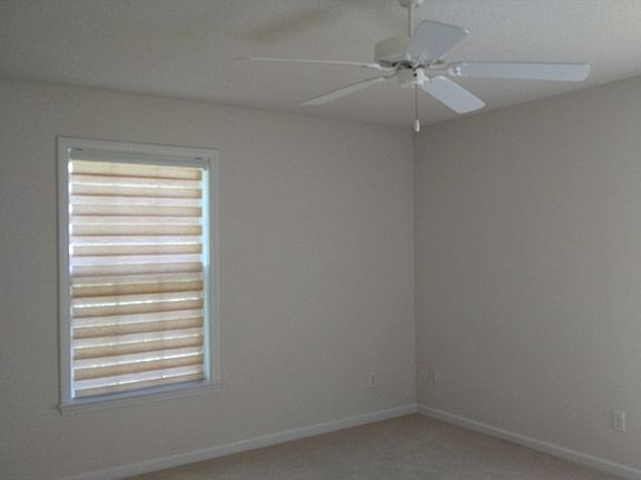 Master bedroom with a bathroom and walk in closet