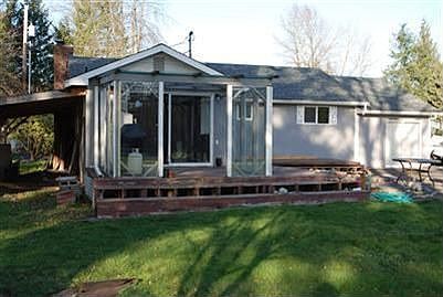 backyard with glassed in deck 