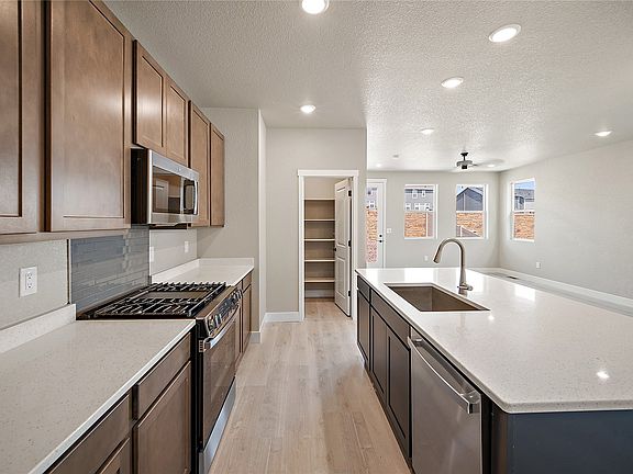 Modern Kitchen with new Appliances to include Microwave, Gas Range, Dish Washer , beautiful Cabinets