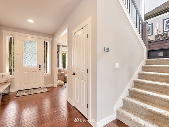 Open entry way, next to den and office. 