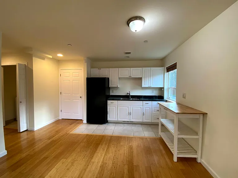Ample kitchen cabinets and island for extra storage.