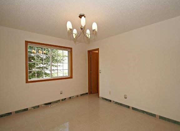 The main floor bedroom offers dual purpose.  A comfortable den for the person who needs an office at home or  additional bedroom