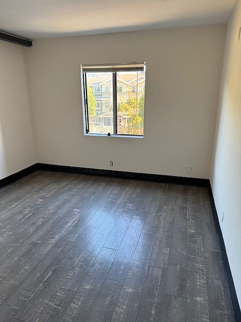Bedroom #2 with one window view.