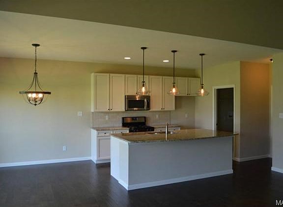 Kitchen has large island, great for entertaining, open to Great