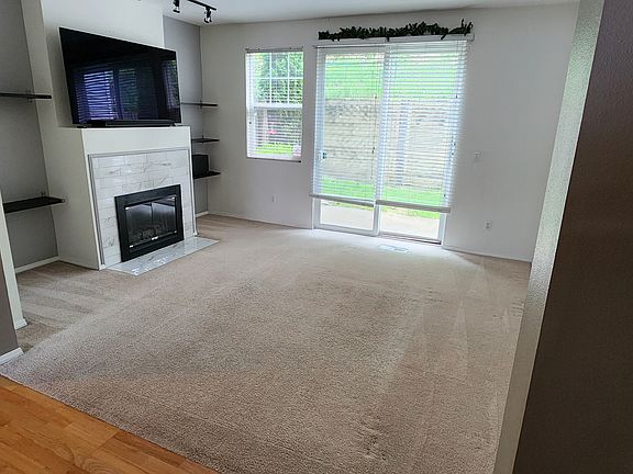 Living room and access to private back patio