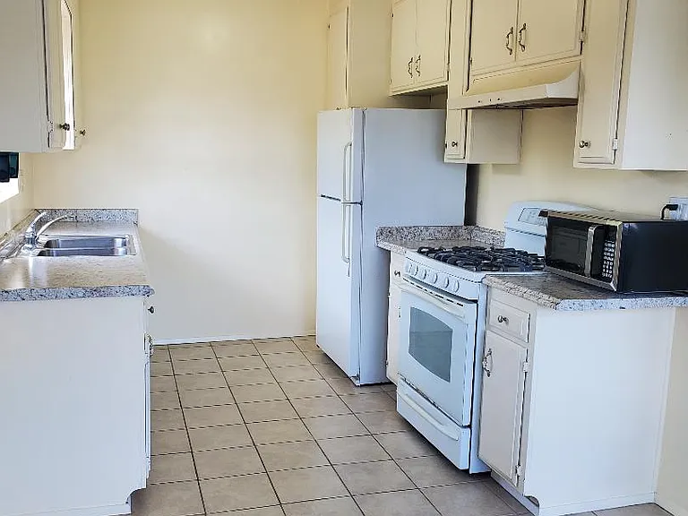 Kitchen stove, refrigerator and microwave