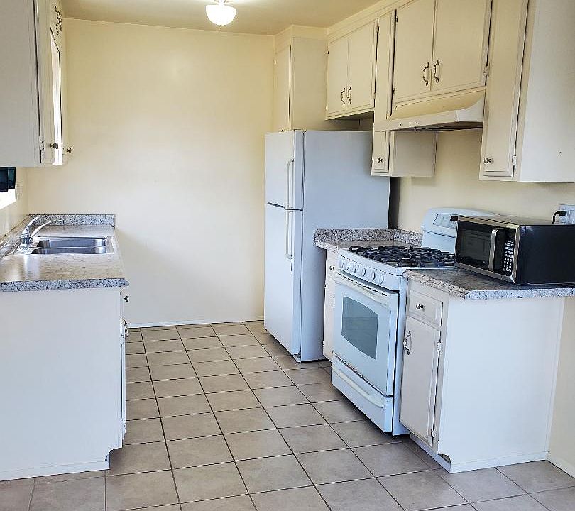 Kitchen stove, refrigerator and microwave