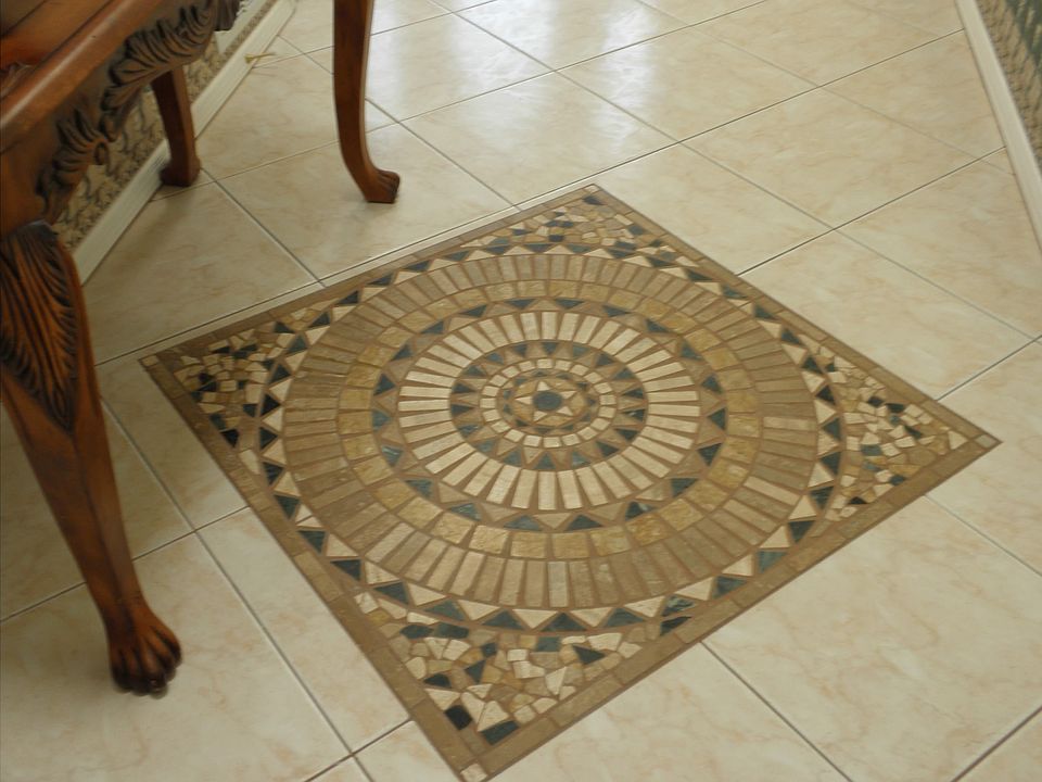 Inlaid tile floor entry way