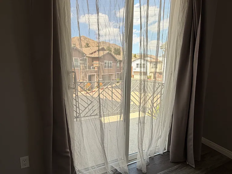 Large balcony sliding doors offer plenty of light and scenic skies.