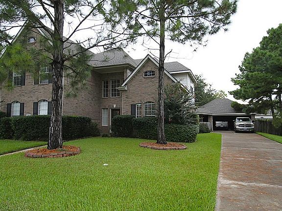 View of home and oversized, 2-car garage