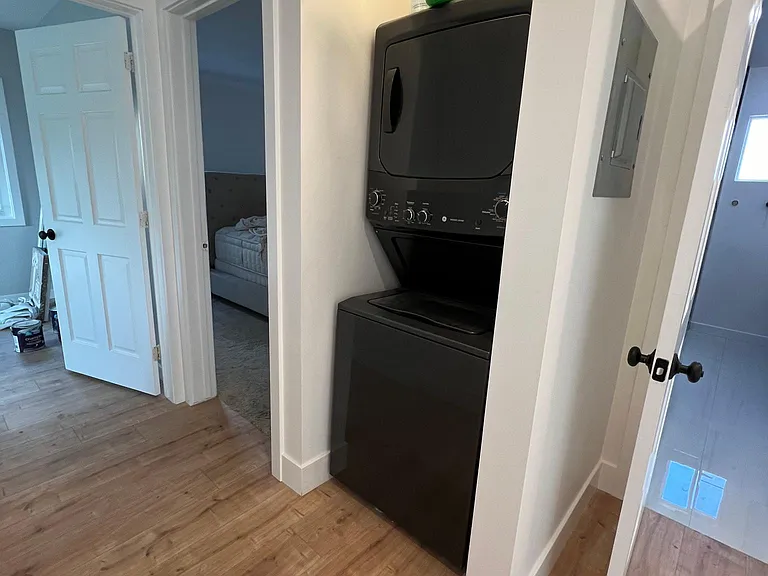 Stackable, washer, and dryer in the hallway