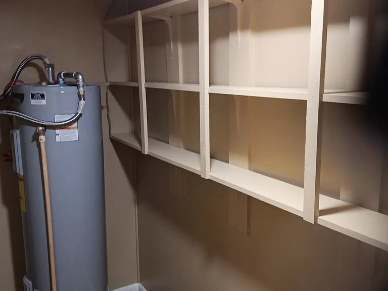 Utility Room with water heater.