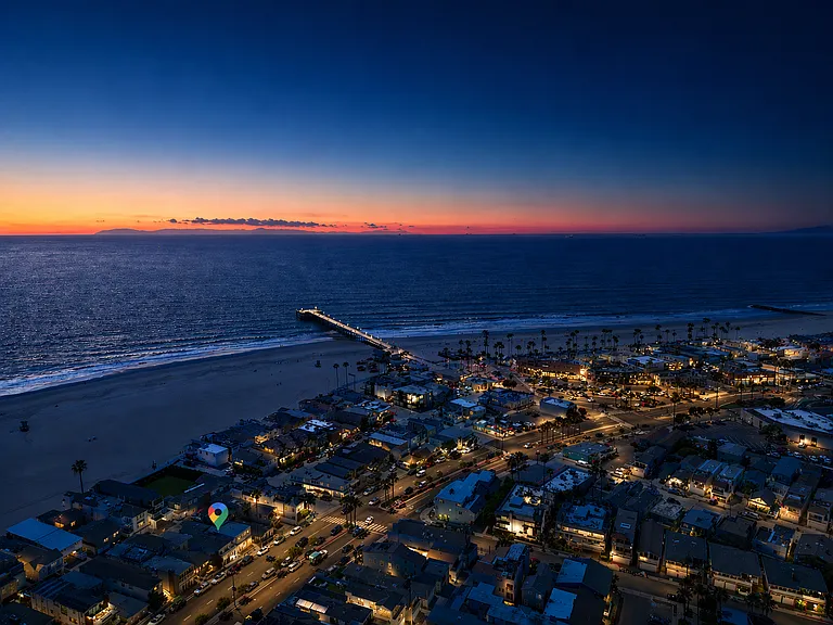 Sunset over Balboa Pier with glowing coastal views