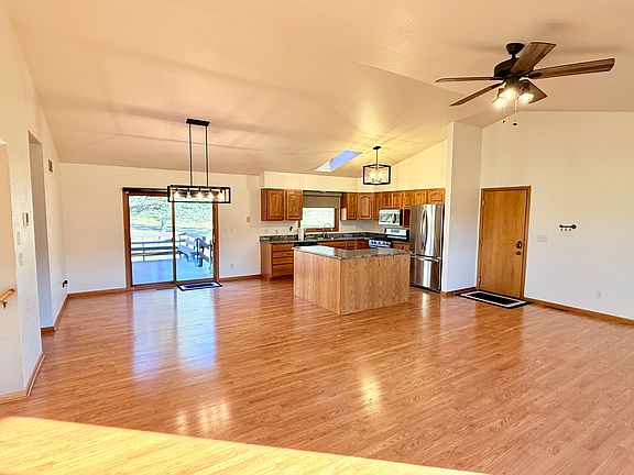 Looking back the other direction to the garage door you see an open floor plan for kitchen and dinning