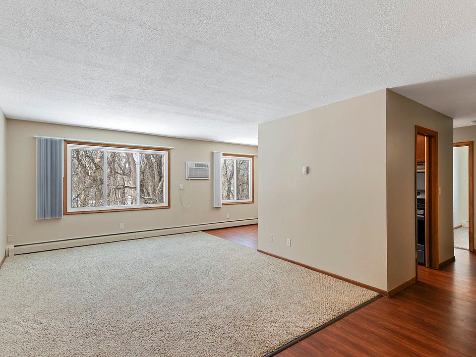 Living room with wall unit air conditioning