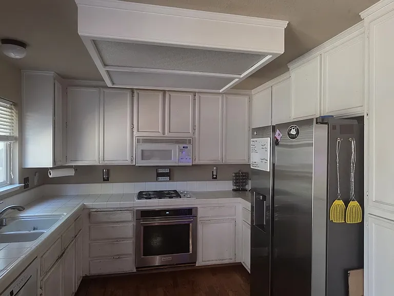 Kitchen Shot Mice Stainless Steel Appliances, Garage has an extra refrigerator also.