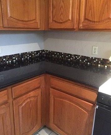 Oak cabinets and granite counters.