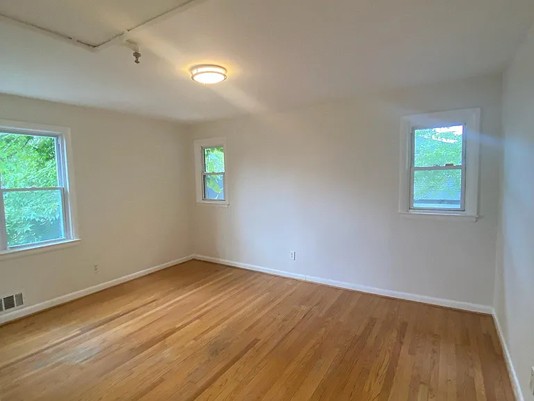 Large primary bedroom fits a king sized bed