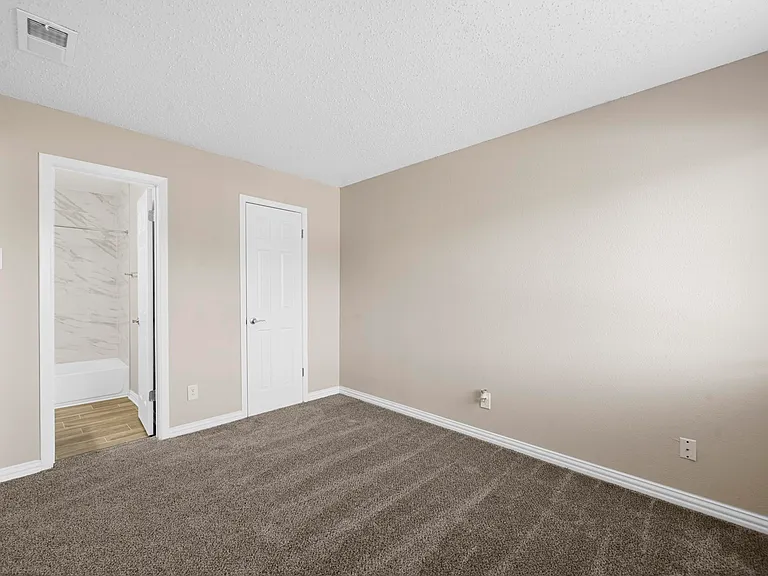 Spacious updated bedroom with attached bathroom