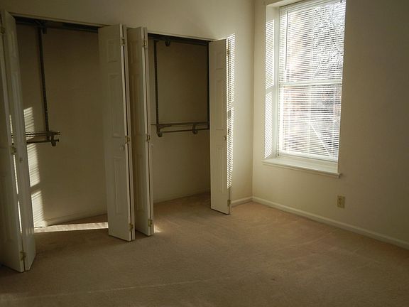 large front bedroom (carpeted) with "organized" closet