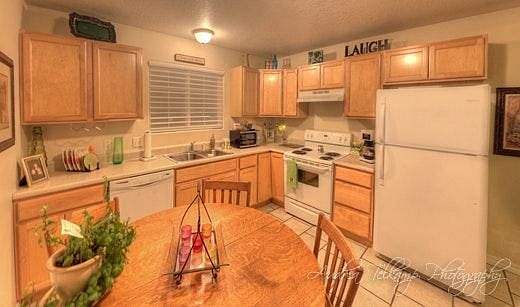 Maple or oak cabinets, tiled floors and room for a large din