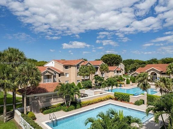 Main pool, kiddie pool jacuzzi, and lobby (with gym inside)