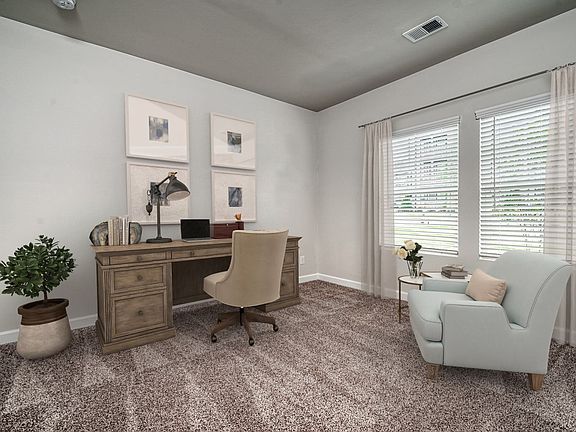 The main-floor bedroom makes the perfect home office, media room or private guest suite.