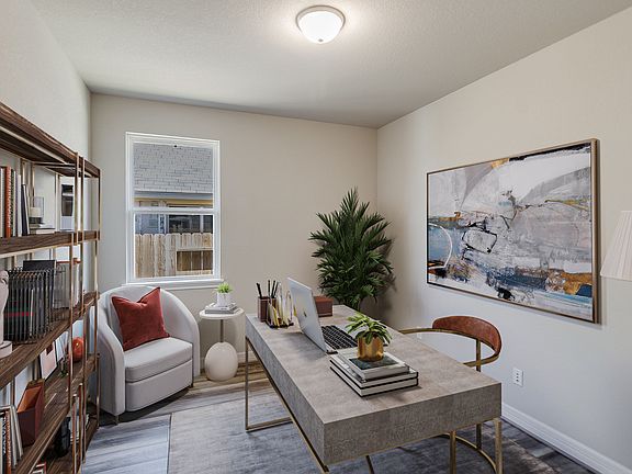 Nestled away quietly in the front of the home is the home office. Featuring high ceilings, gorgeous