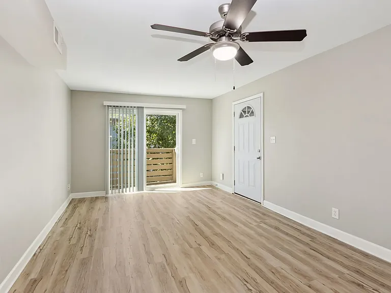 Spacious Living Area w/ Balcony Access