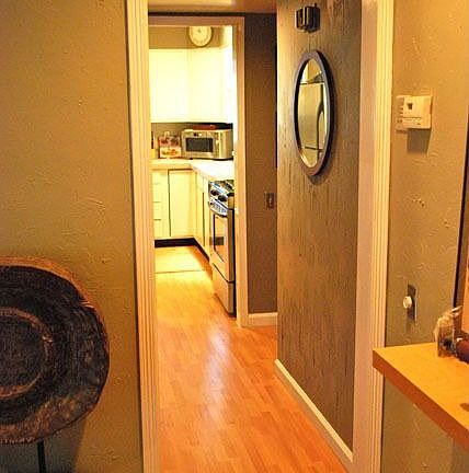 Hallway with plenty of closet storage space.