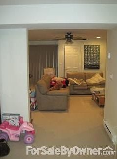 Basement View
						:
						Looking into basement family room from room at base of stairs. Laundry to rt.
