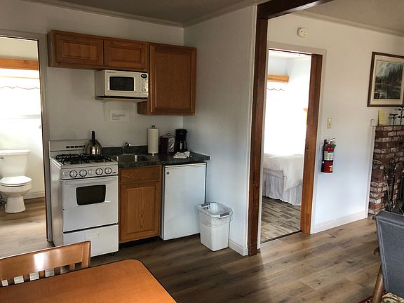 Kitchen with bathroom and bedroom visible