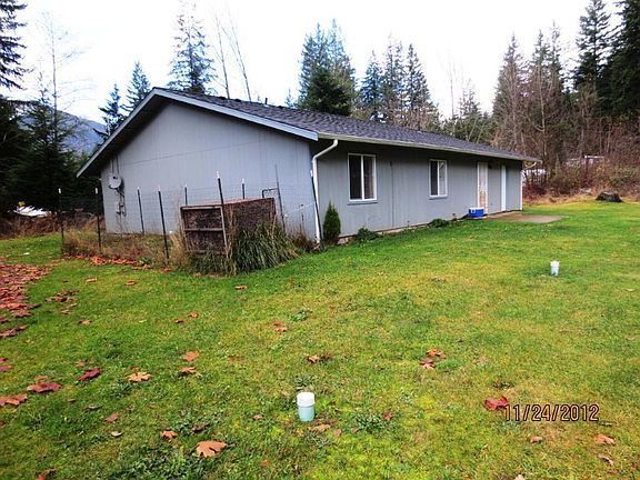 Back yard view with ample space for garden space. Fenced-in dog run.