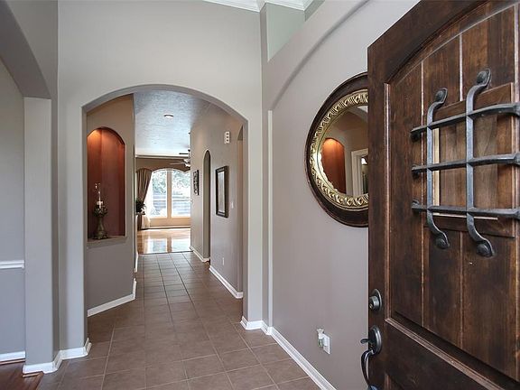 Enter through the upgraded front door to high ceilings, fresh paint and nicely appointed architectural details.