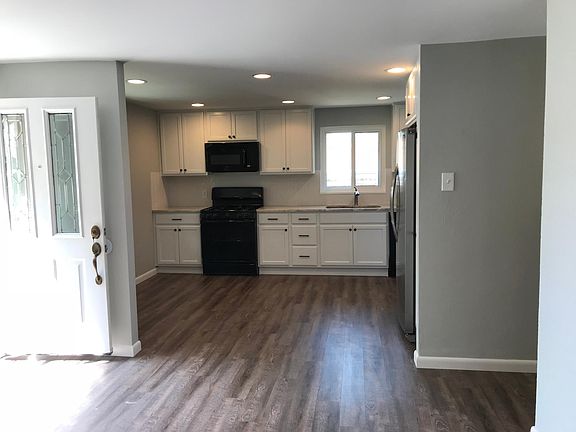 front entrance opens to kitchen and living room