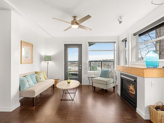 Living room with fireplace and patio access