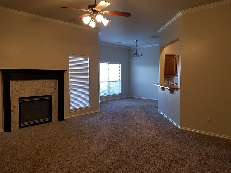 Living room and formal dining room or sitting room with bar pass through to kitchen.