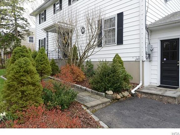 Walkway to front door and door to garage