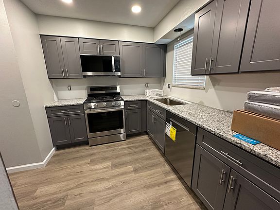 Full kitchen remodel, vinyl plank flooring, new soft close cabinets, granite countertop, ceramic tile, and stainless steel appliances, gas stove, built in microwave and hood, disposal, dishwasher and side by side refrigerator