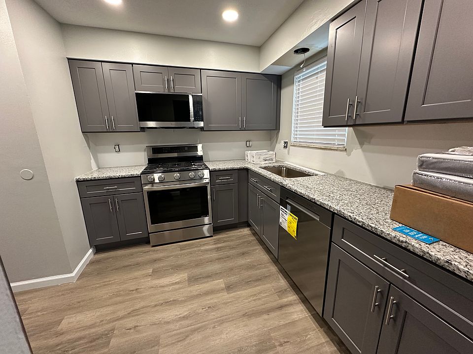 Full kitchen remodel, vinyl plank flooring, new soft close cabinets, granite countertop, ceramic tile, and stainless steel appliances, gas stove, built in microwave and hood, disposal, dishwasher and side by side refrigerator