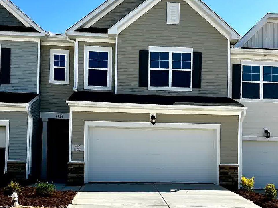 Entrance of newly build house from Arkose Dr facing North. It has two car garage and entrance is left side of the garage.
