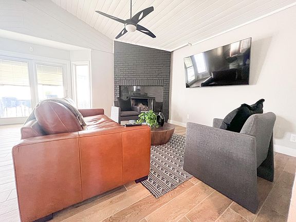 Comfortable seating area and 70" Smart TV.