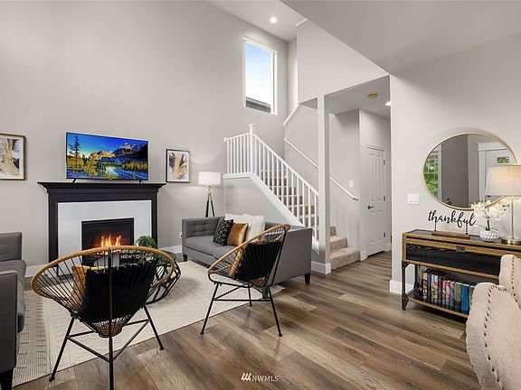 New luxury vinyl plank flooring on the main, white 6-panel doors and fresh interior paint.