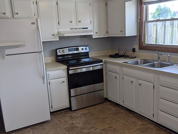 Picture is dated. New flooring, countertop and cabinets installed.