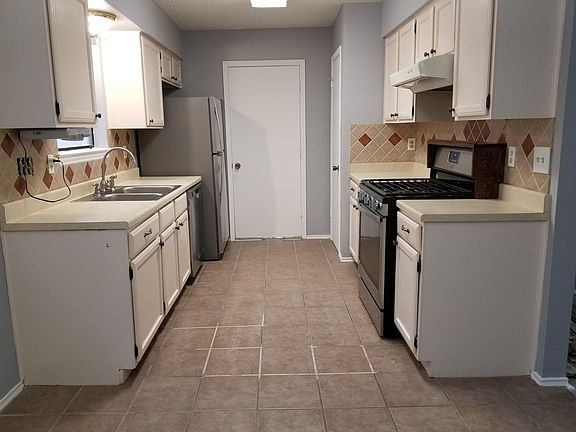 Kitchen with new stainless steel appliance package