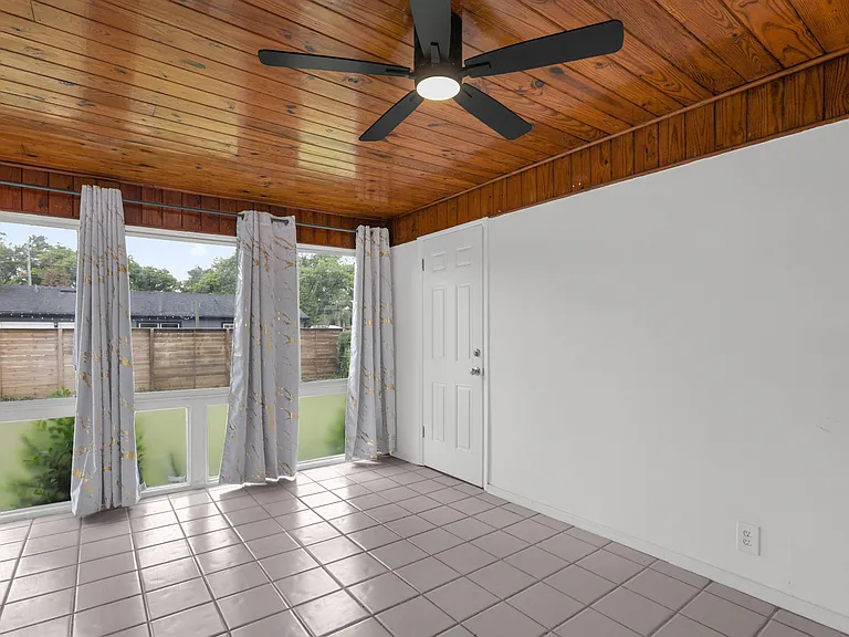 second living area overlooking the backyard
