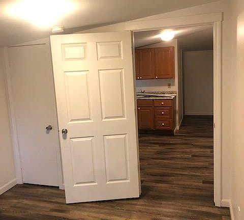 bedroom showing living room beyond