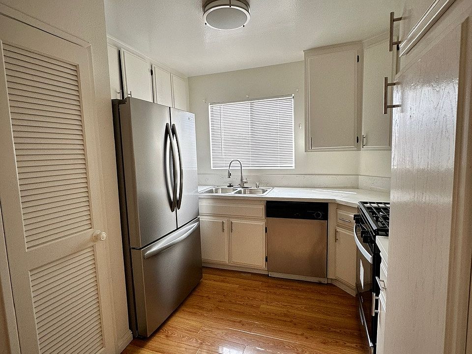 Remodeled Kitchen with new gas range, fridge, and dishwasher.