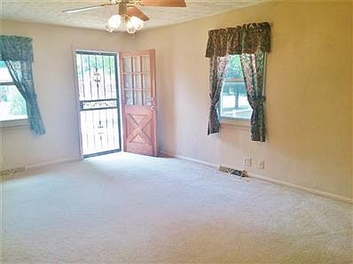 Living room connects the kitchen/dining combo with the bedrooms.