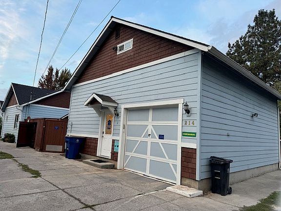 View of front door and garage door